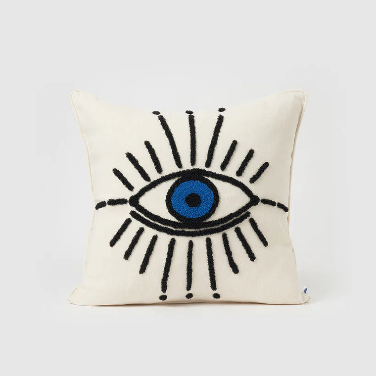 Decorative pillow with an eye design on a white background
