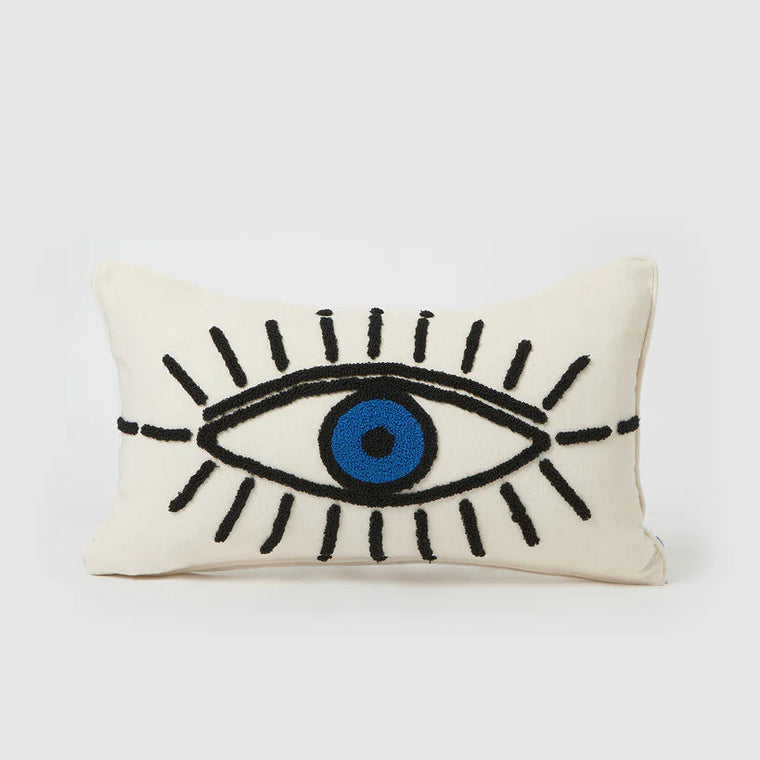 Decorative pillow with eye design on a white background