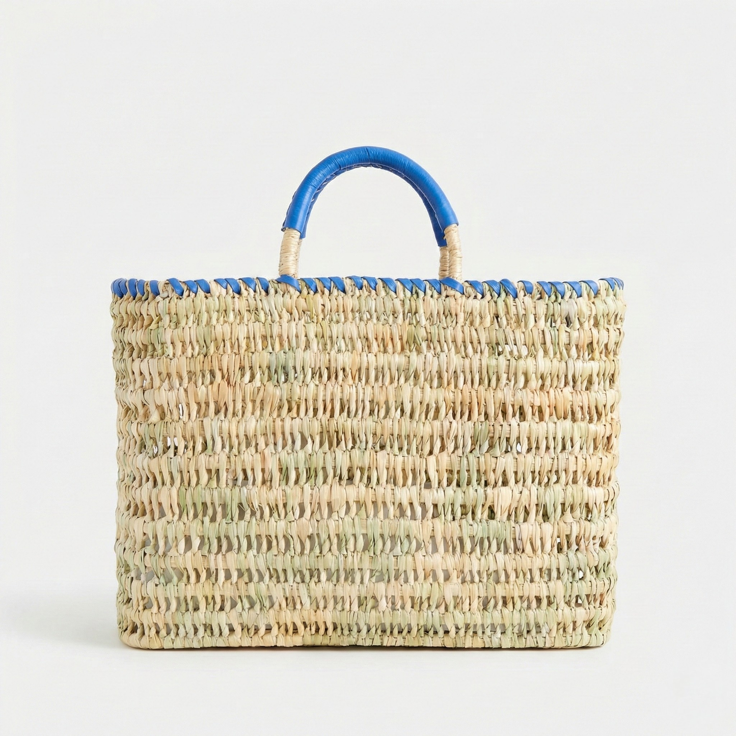 Woven handbag with blue handles on a white background