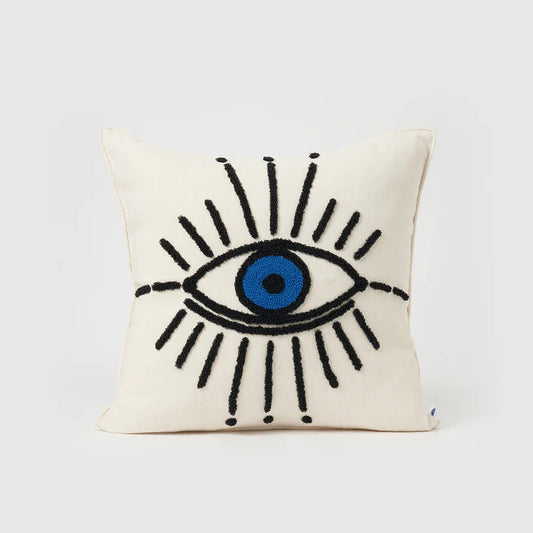 Decorative pillow with an eye design on a white background