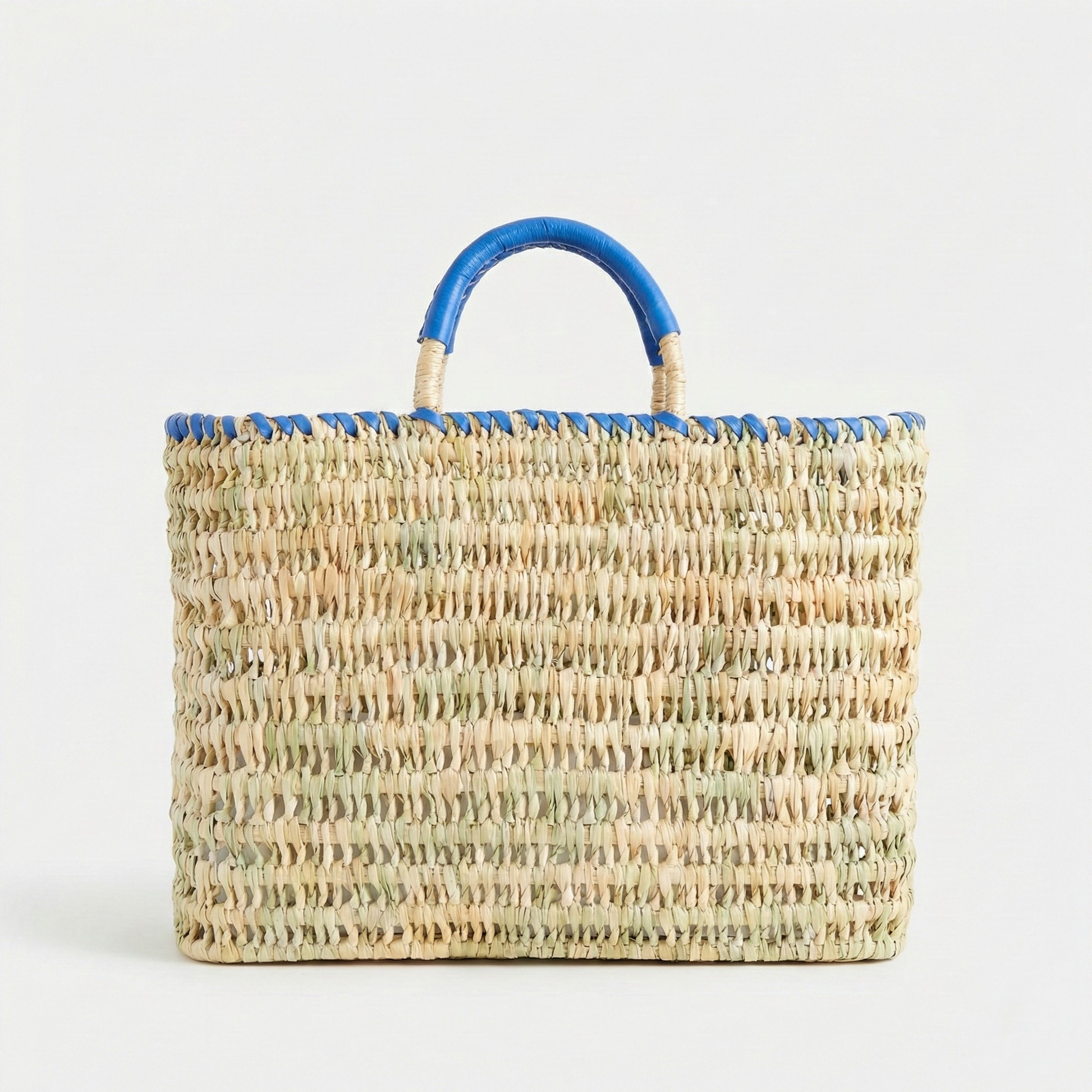 Woven handbag with blue handles on a white background