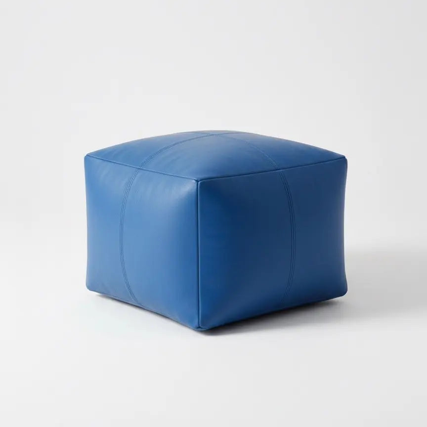 Blue cube-shaped ottoman on a white background