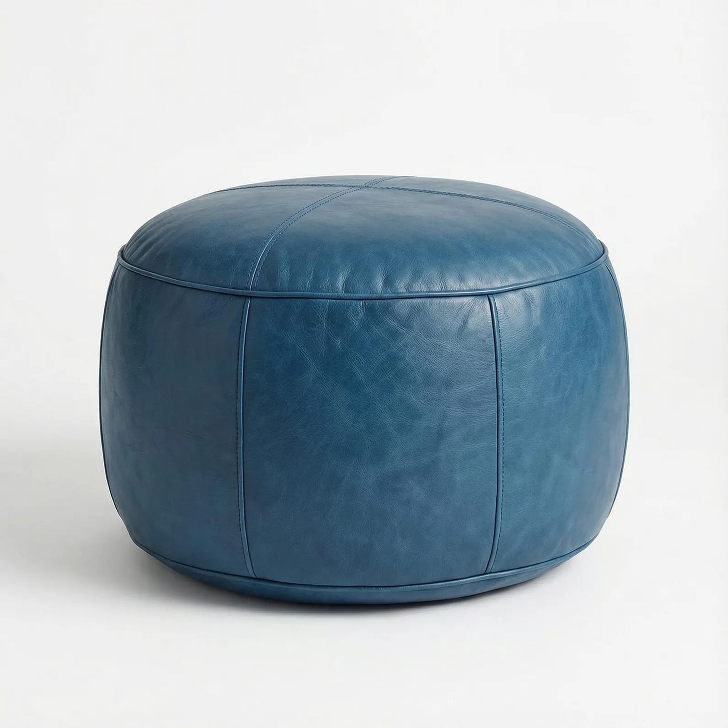 Blue leather ottoman on a white background