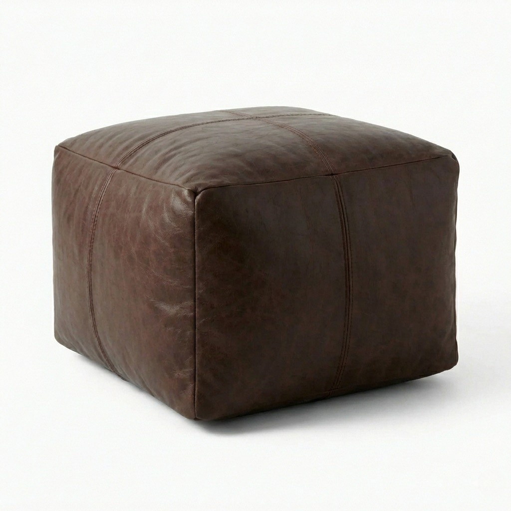 Brown leather cube ottoman on a white background