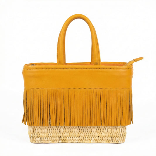 Yellow handbag with fringes on a white background
