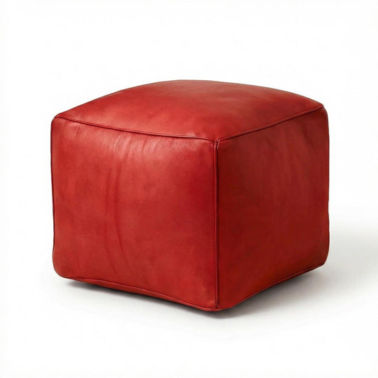 Red cube-shaped ottoman on a white background